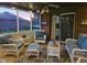 Cozy screened porch with comfortable seating, a ceiling fan, and brick accents at 1515 Renee Dr, Plainfield, IN 46168