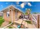 Backyard patio with a grill, table and chairs, and a decorative metal security door at 2150 Main St, Beech Grove, IN 46107