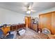 Spacious room with patterned rug, vintage furniture, ceiling fan, and closet at 2150 Main St, Beech Grove, IN 46107