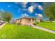 Well-kept home features lush green lawn and a tidy front entrance at 2150 Main St, Beech Grove, IN 46107