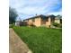 Lovely brick home featuring a beautiful lawn and established landscaping at 2150 Main St, Beech Grove, IN 46107