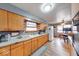 Kitchen with wood cabinets and views to the dining area at 2150 Main St, Beech Grove, IN 46107
