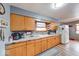 Functional kitchen offers ample counter space and wooden cabinetry at 2150 Main St, Beech Grove, IN 46107