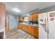 Kitchen featuring wood cabinets, sink, and appliances at 2150 Main St, Beech Grove, IN 46107