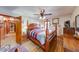 Bedroom with a four-poster bed, wood flooring, and neutral walls at 2150 Main St, Beech Grove, IN 46107