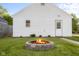Backyard with fire pit and well-manicured lawn at 2336 Sycamore St, Columbus, IN 47201