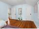 Bedroom with light blue walls, hardwood floors and plant at 2336 Sycamore St, Columbus, IN 47201