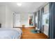 Bright bedroom with hardwood floors, natural light and light blue curtains at 2336 Sycamore St, Columbus, IN 47201