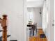 A view of the dining room through a doorway that shows a wood table and hardwood floors at 2336 Sycamore St, Columbus, IN 47201
