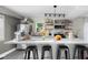 Bright kitchen features a marble island, stainless steel appliances and open shelving at 2336 Sycamore St, Columbus, IN 47201