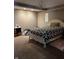 Neutral bedroom featuring a decorative chandelier and a comfortable looking bed at , Shelbyville, IN 46176