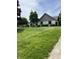 Well-manicured lawn and landscaped yard enhance this charming home's curb appeal at , Shelbyville, IN 46176