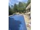 Backyard showcasing a large in-ground pool, complete with lounge chairs and outdoor seating areas at , Shelbyville, IN 46176