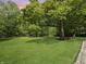 Expansive backyard with mature trees, a lush lawn and room to roam at 2548 N Letterman Rd, Paragon, IN 46166