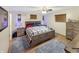 Comfortable bedroom featuring a cozy bed, wooden furniture and blue rugs at 2548 N Letterman Rd, Paragon, IN 46166