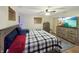 Bedroom featuring a comfortable bed, natural light, and a mounted television at 2548 N Letterman Rd, Paragon, IN 46166