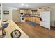 The kitchen features light wooden cabinets, a blue rug, and modern appliances at 2548 N Letterman Rd, Paragon, IN 46166