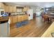 Open-concept kitchen featuring modern appliances, wood cabinets, and seamless flow into the living area at 2548 N Letterman Rd, Paragon, IN 46166