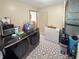 Modern laundry room with black stainless steel washer, dryer and patterned flooring at 2548 N Letterman Rd, Paragon, IN 46166