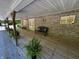 Inviting covered porch featuring a bench, potted plants, and brick facade at 2548 N Letterman Rd, Paragon, IN 46166
