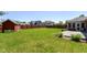 Large backyard with a wooden deck, a storage shed and mature trees at 3126 Oakmont Dr, Lapel, IN 46051