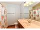 Bathroom featuring a floral shower curtain, light wood vanity and ample lighting at 3126 Oakmont Dr, Lapel, IN 46051