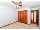 Carpeted bedroom features a closet, and a view to an adjacent room at 3126 Oakmont Dr, Lapel, IN 46051