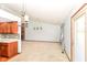 Spacious living room with neutral carpet and view into the kitchen and dining area at 3126 Oakmont Dr, Lapel, IN 46051