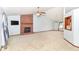 Open living room featuring a brick fireplace, neutral carpeting, and ample space for furnishings at 3126 Oakmont Dr, Lapel, IN 46051