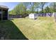 The spacious backyard has a well-kept lawn and a storage shed at 320 Red Tail Ln, Indianapolis, IN 46241