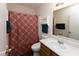 Bathroom with a single sink vanity, toilet and shower/tub combo with curtain at 320 Red Tail Ln, Indianapolis, IN 46241