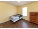 Bright bedroom with wood floor and natural light, perfect for relaxation and rest at 320 Red Tail Ln, Indianapolis, IN 46241