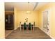 Cozy dining room with hardwood floors, a modern table set, and ample natural light at 320 Red Tail Ln, Indianapolis, IN 46241