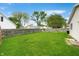 Large backyard featuring a lush lawn, fenced perimeter, and mature trees at 3334 Old Field Ln, Columbus, IN 47203