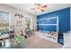 Bright bedroom features a unique house frame bed, toy kitchen, and two large windows at 3334 Old Field Ln, Columbus, IN 47203