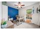 Cozy bedroom features a ceiling fan and desk area, perfect for work or study at 3334 Old Field Ln, Columbus, IN 47203