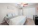 Comfortable bedroom features a ceiling fan, closet, and charming decor at 3334 Old Field Ln, Columbus, IN 47203