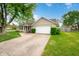 Charming single-story home features a well-maintained front yard and paved driveway at 3334 Old Field Ln, Columbus, IN 47203