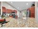 Open eat-in kitchen featuring granite countertops, stainless appliances and lots of cabinet space at 3334 Old Field Ln, Columbus, IN 47203