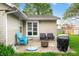 Inviting backyard patio area featuring outdoor seating, fire pit, and grill at 3334 Old Field Ln, Columbus, IN 47203