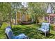 Shaded backyard with lawn chairs, hammock, and trees create a relaxing oasis at 3433 Brewer Dr, Indianapolis, IN 46222