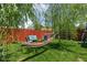 Relaxing backyard featuring a hammock, outdoor seating, and lush green grass at 3433 Brewer Dr, Indianapolis, IN 46222
