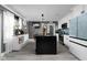Modern kitchen with a large island, white cabinets, and stainless steel appliances at 3433 Brewer Dr, Indianapolis, IN 46222