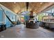 Enclosed porch with wood ceiling, stone fireplace, outdoor seating, and a hammock at 3433 Brewer Dr, Indianapolis, IN 46222