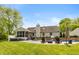 This backyard features a large pool, hot tub, screened-in porch, and ample seating making it perfect for entertaining at 35 Valley View, Brownsburg, IN 46112