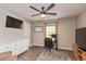 Bedroom featuring a ceiling fan, a work-from-home area, and hardwood floors at 35 Valley View, Brownsburg, IN 46112