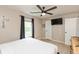 Bedroom with a modern ceiling fan, mounted television, and neutral paint at 35 Valley View, Brownsburg, IN 46112