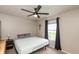 Comfortable bedroom featuring a ceiling fan, neutral tones, and a bright window view at 35 Valley View, Brownsburg, IN 46112