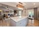 Open kitchen with hardwood floors that lead into a living room with comfortable seating at 35 Valley View, Brownsburg, IN 46112