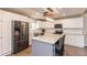 Bright kitchen with stainless steel appliances, granite countertops, and sleek white cabinetry at 35 Valley View, Brownsburg, IN 46112